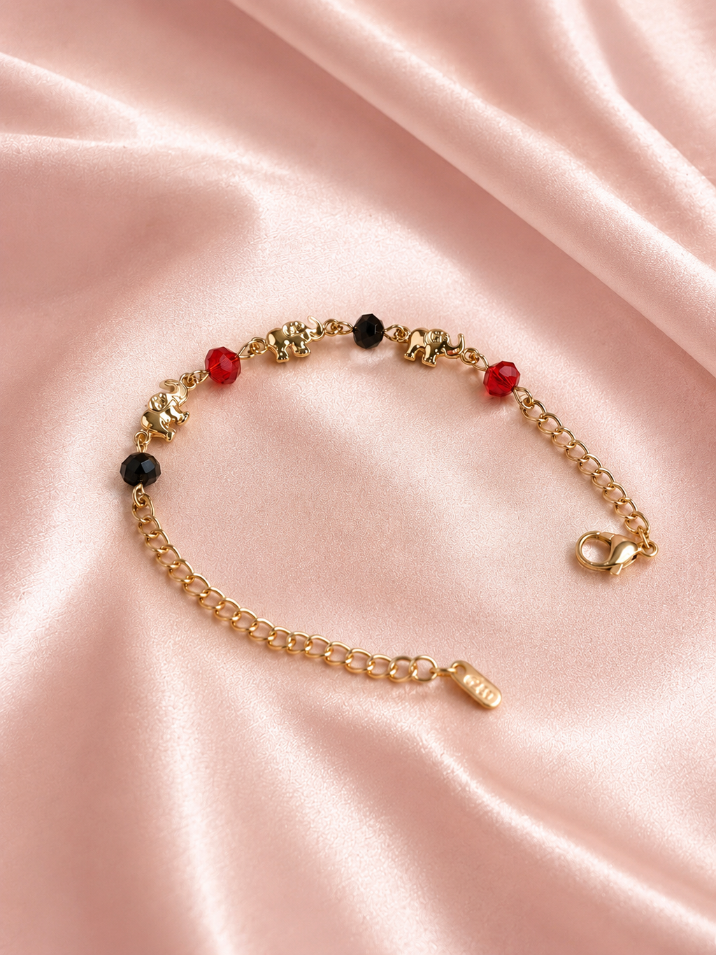 Pulsera de elefante con detalles rojo y negro - Oro laminado 14K